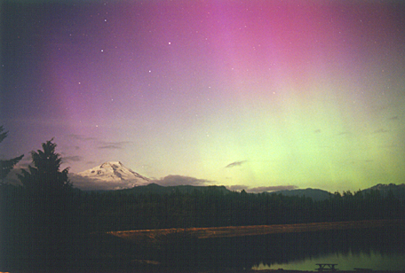 Blue and green and purple streaks in the evening sky