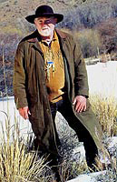 man standing in the snowy hills