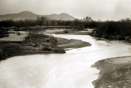 shallow river flowing through dry country